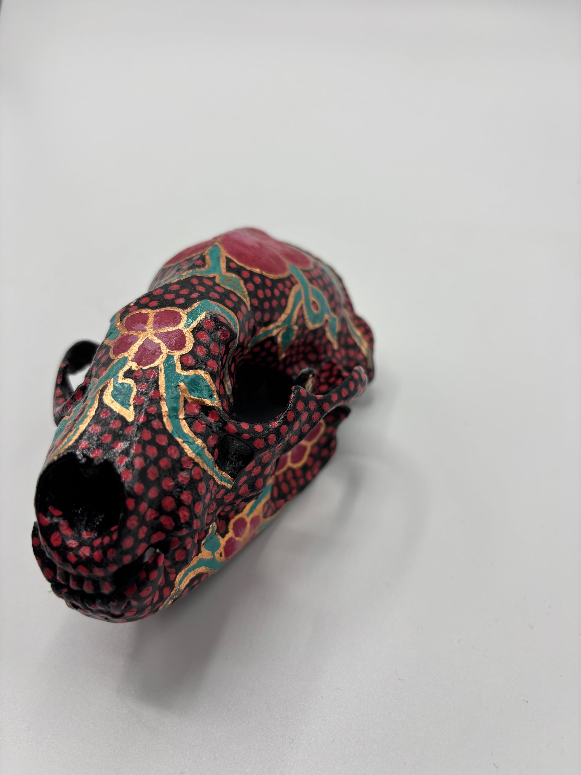 Decorative object with floral patterns on a white background