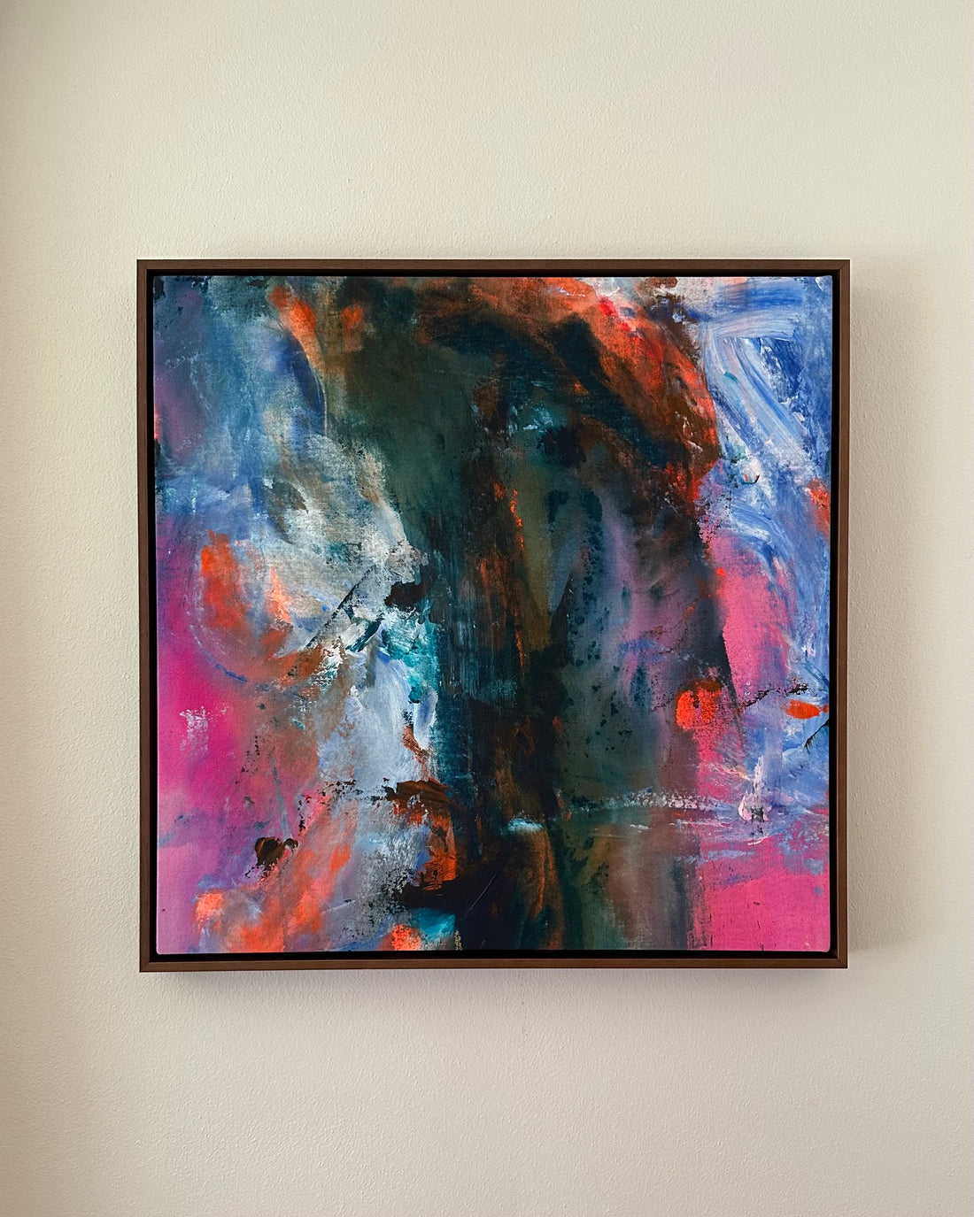 an abstract painting with vibrant neon pink, shades of blue and dark green