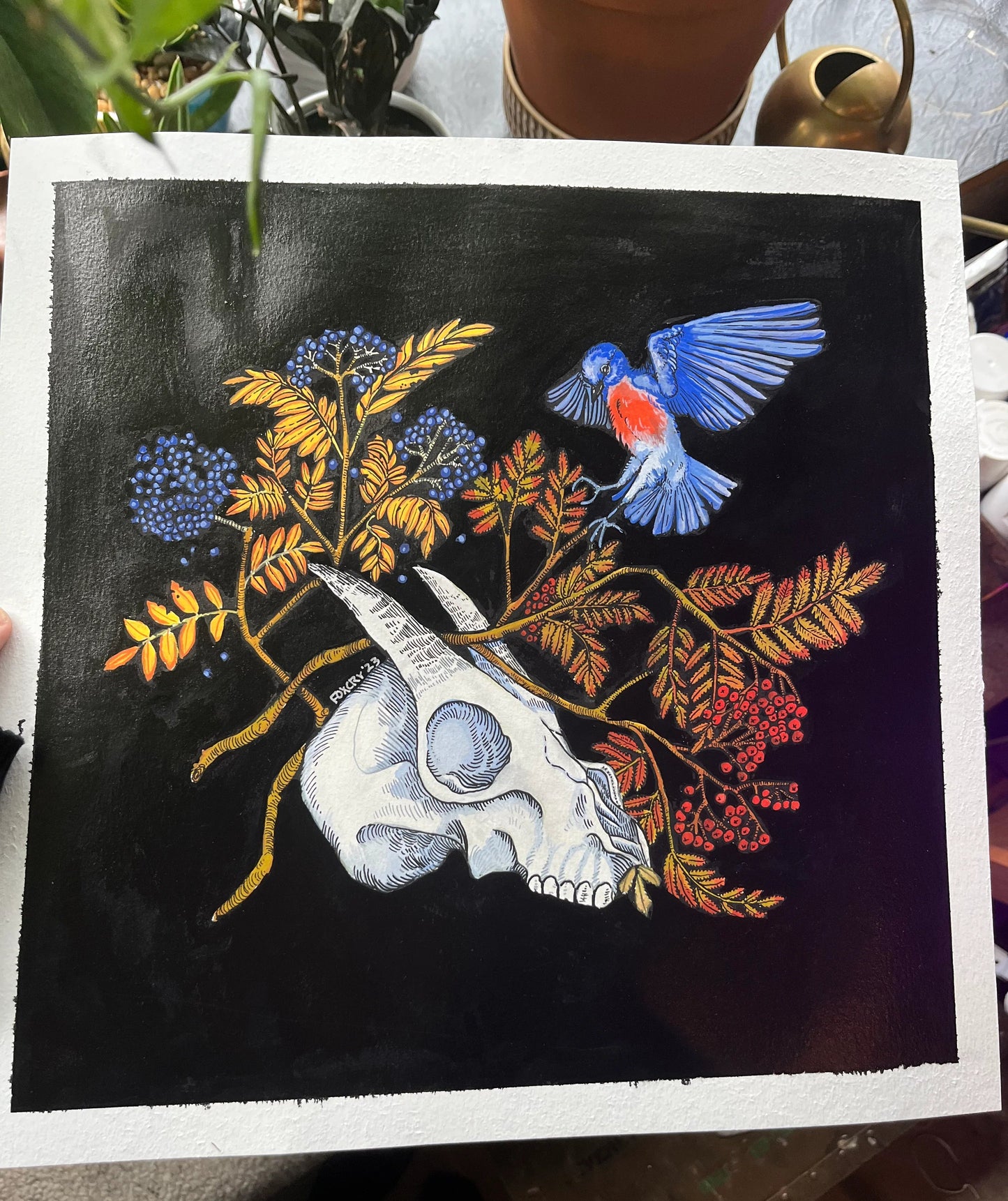 Artistic depiction of a bird, skull, and floral elements on a dark background