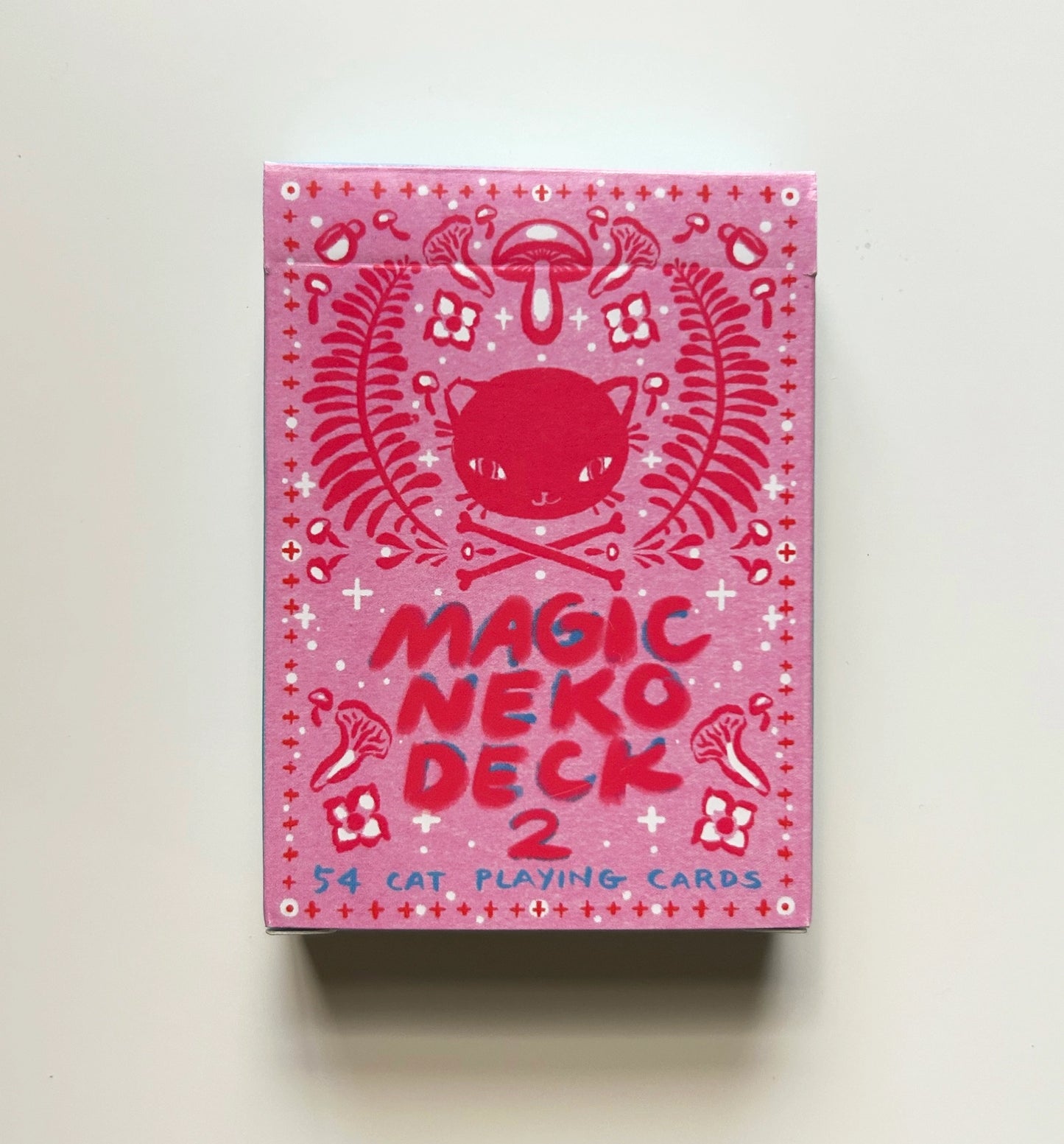 Pink 'Magic Neko Deck 2' playing cards box with cat illustration on a white background