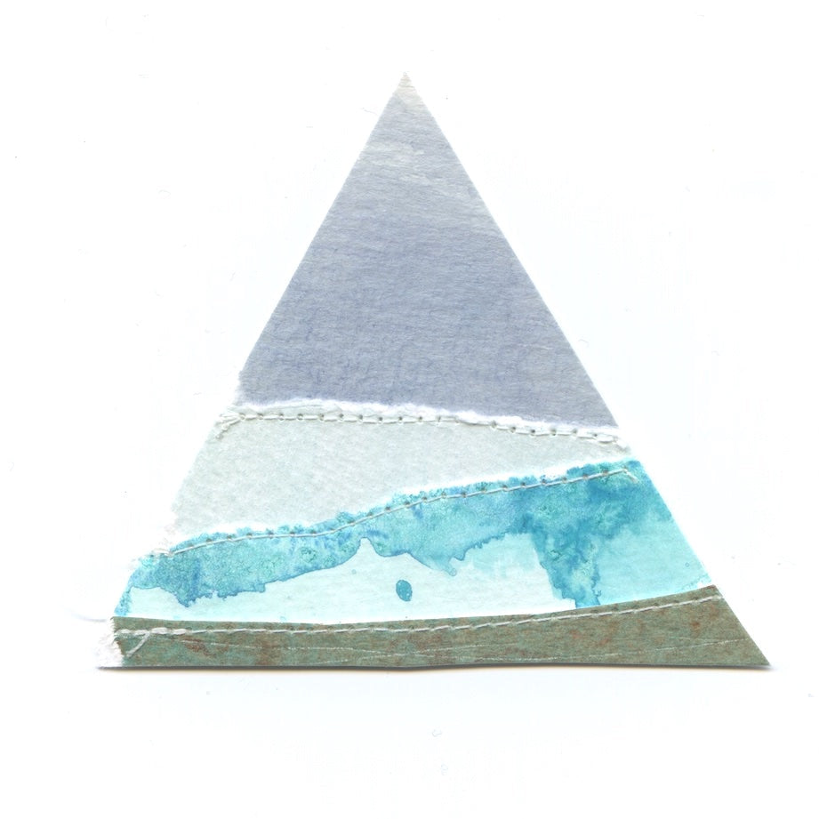 Triangular paper craft with watercolor design on a white background