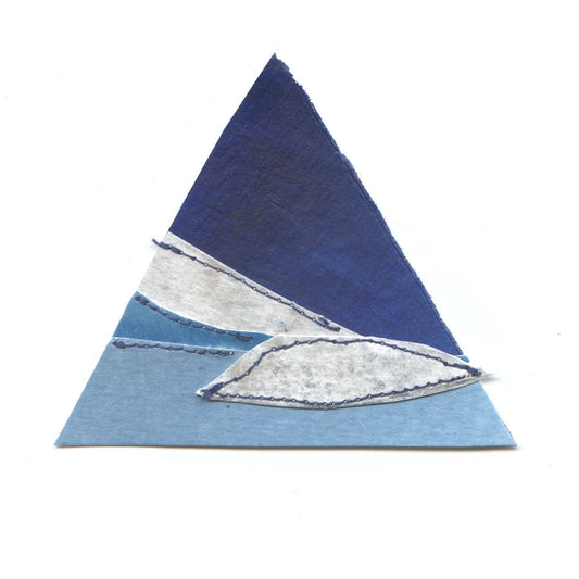 Triangular rug with blue and gray gradient on a white background