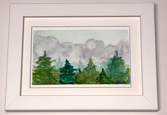 Framed watercolor painting of trees with a gray sky